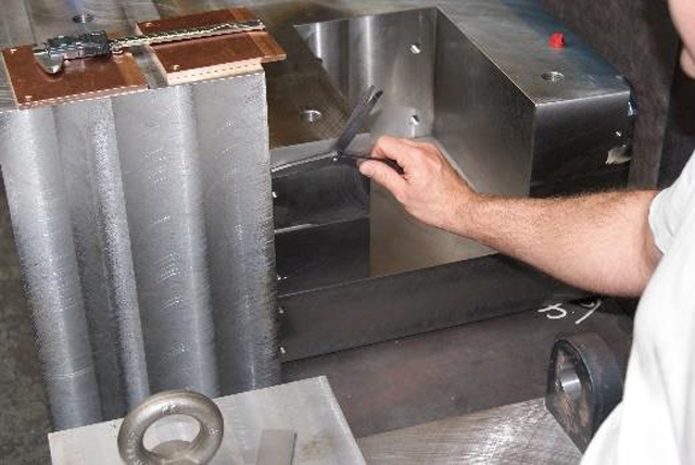 Engineering performing quality checks.